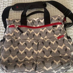 Skip Hop Black and Cream Baby Bag with Red Accents